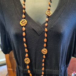 Necklace Long Orangish Brown Light Material Wood?
