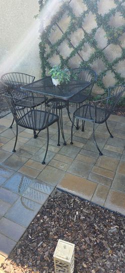 Wrought iron patio table and 4 chairs (NW area)