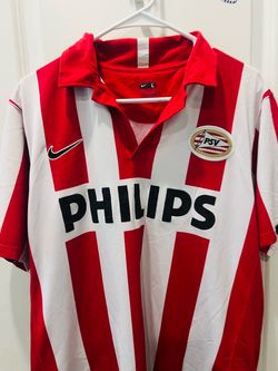 This is a vintage Nike PSV Eindhoven home shirt, recognizable by its classic red and white stripes
