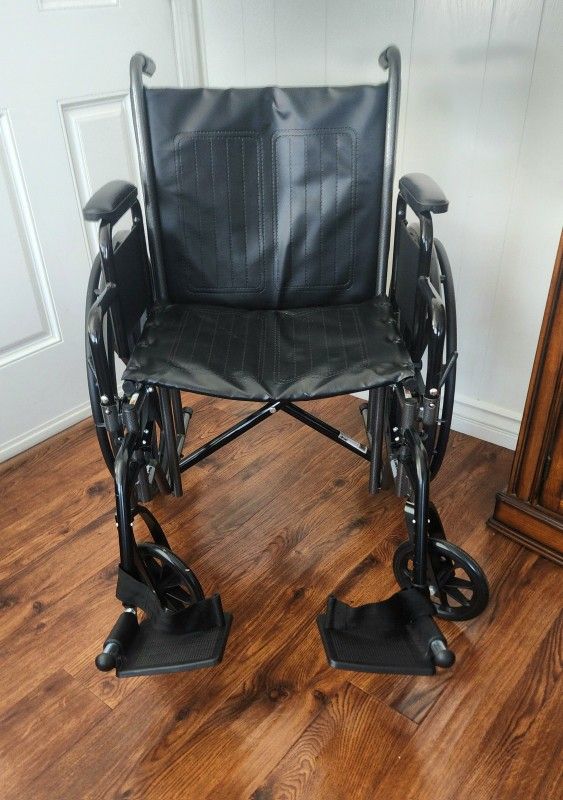 DRIVE WHEELCHAIR.   BLACK, LEG EXTENDERS. EXCELLENT CONDITION! LIKE NEW!!!