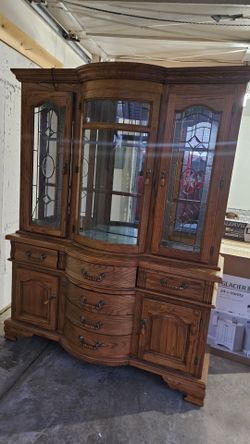 This large two-piece oak china cabinet