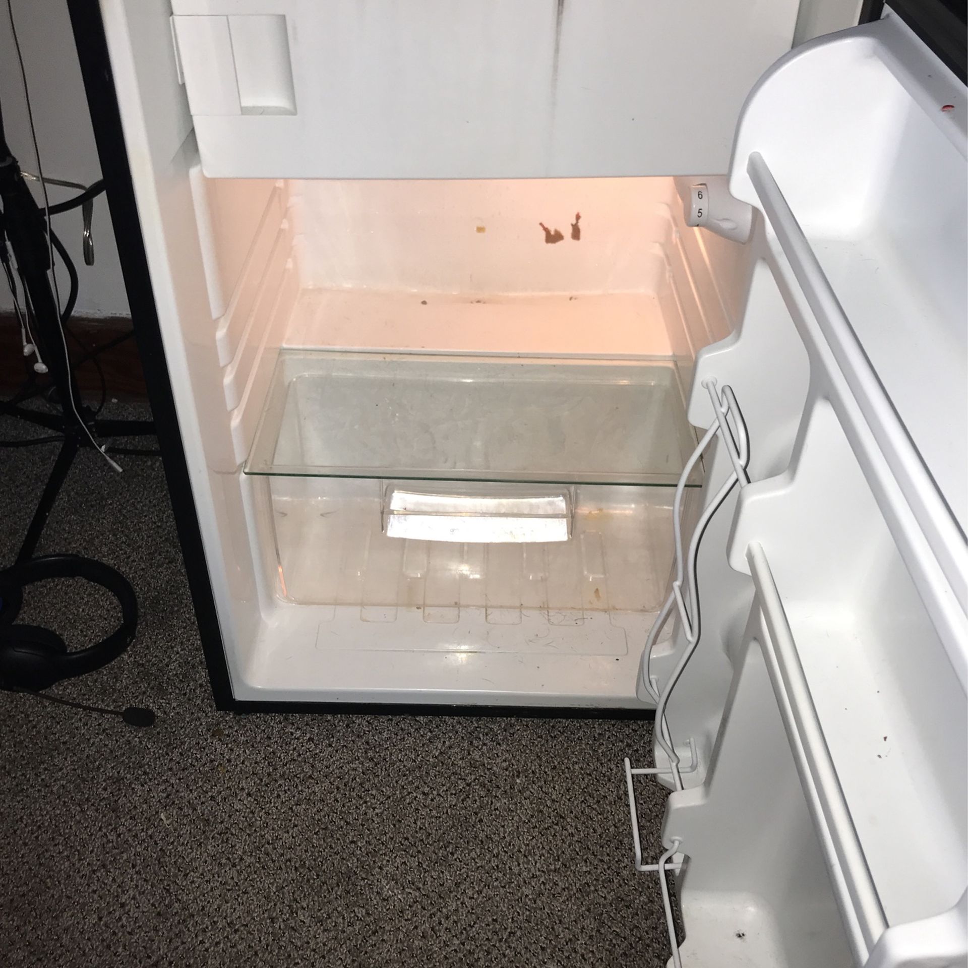 Frigidaire mini refrigerator, nothing wrong with it works perfectly fine! will be cleaned out for whoever buys it! needs gone ASAP!