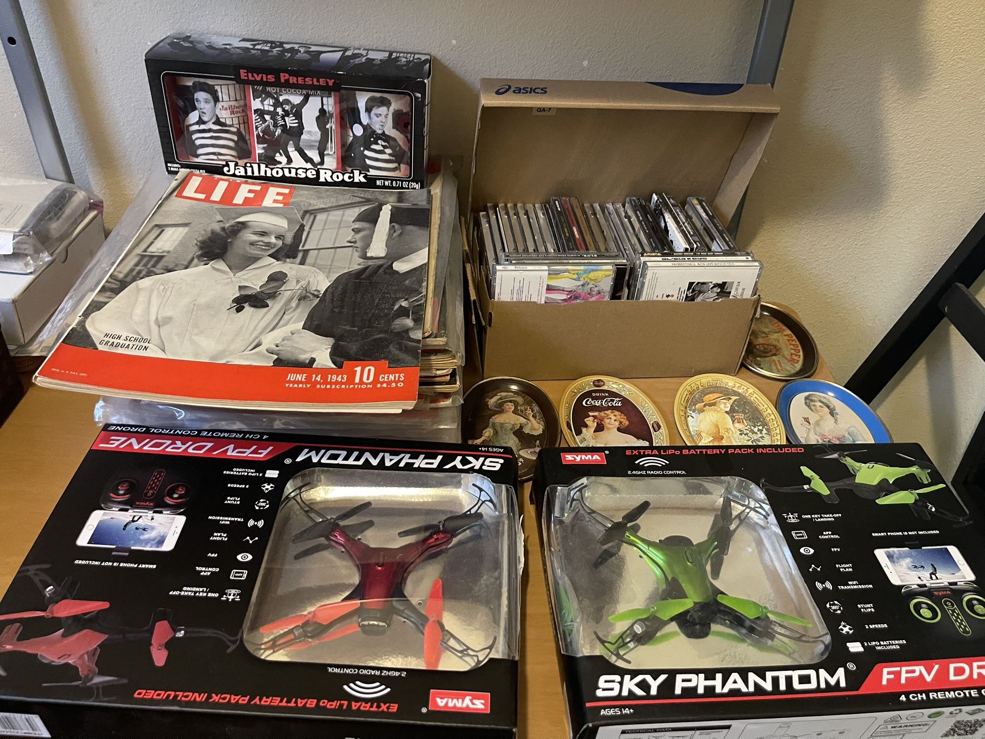 Life Magazines, Two Drones, A Lot Of Old Cds, Elvis Presley Cups, small Coca-Cola tray