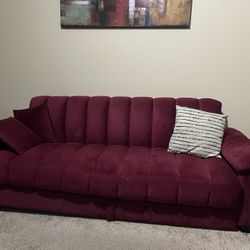 Burgundy futon and Two Pillows
