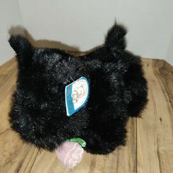 Kellytoy Black Scottie Dog Plush With Pink Rose 10'in Tall & 12'in Long. Has some wear from age and use. Also battery function is not working. Sold as