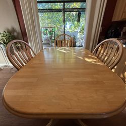 Extendable Beachwood table with four chairs