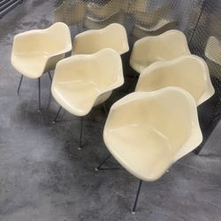 Set of 6 mid century modern Herman Miller shell chairs on a H base near the Miami Design District
