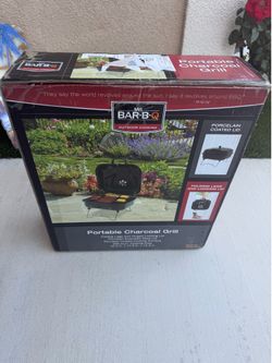 Portable charcoal grill