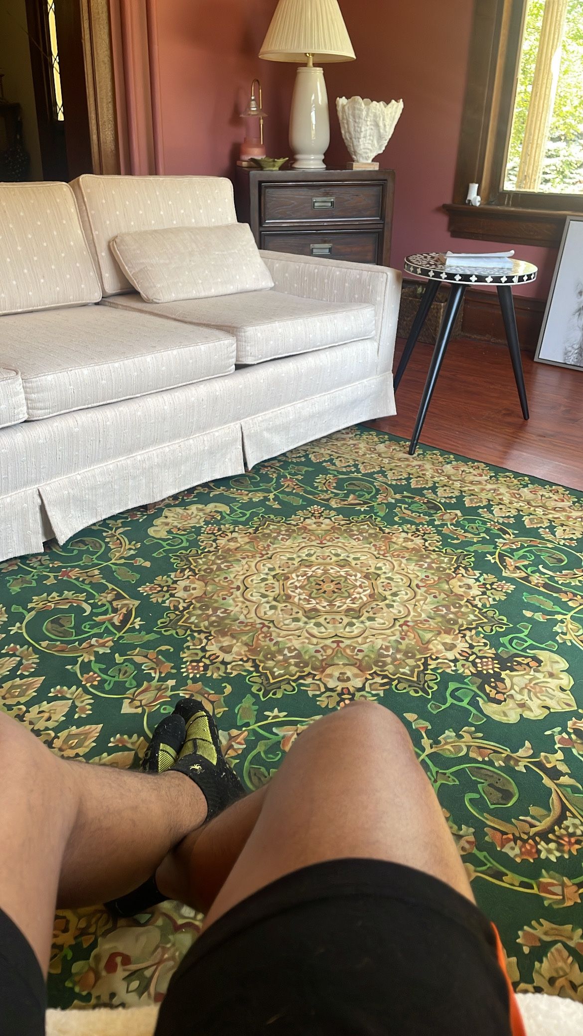 Green rug off white Sofa