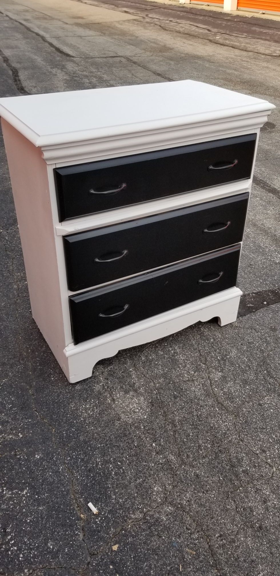 White dresser with black drawers