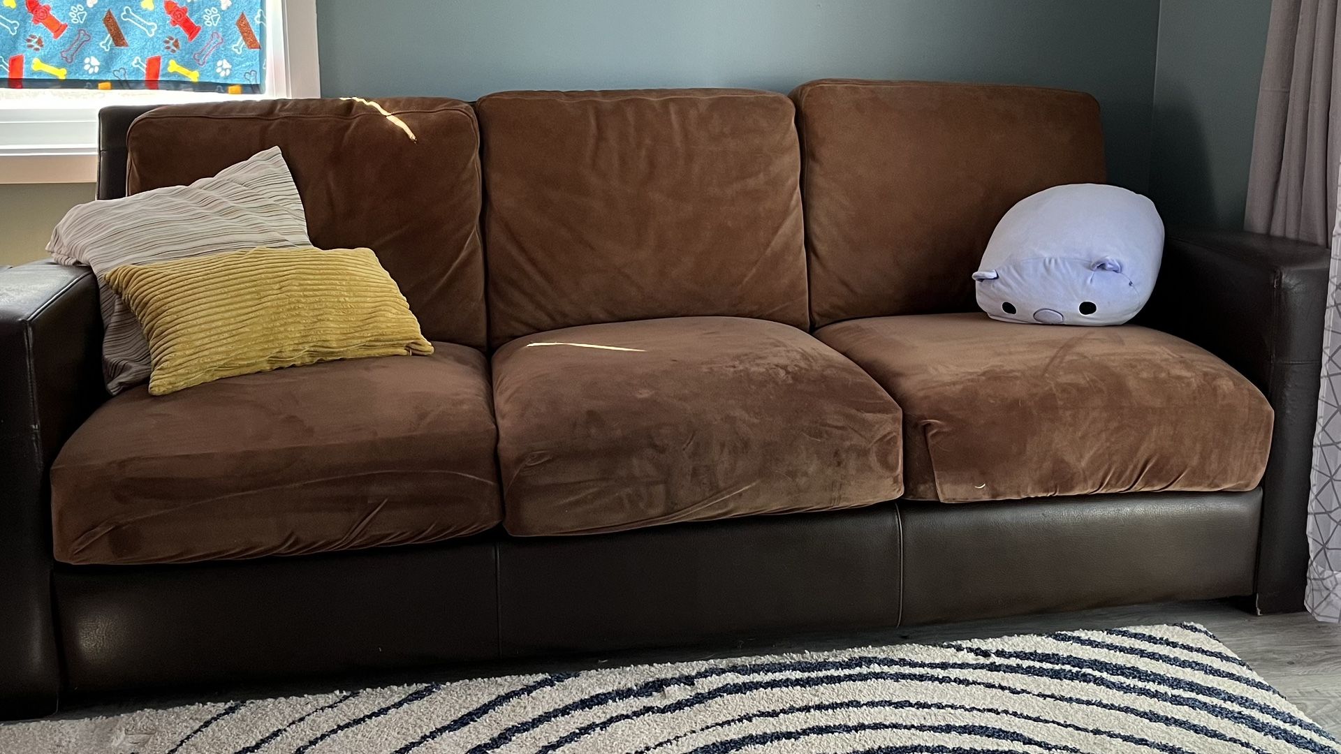 Leather and suede sofa with cushion covers