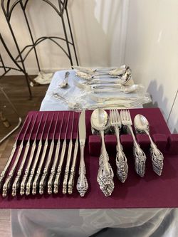 Silver Flatware Set with Ornate Handles