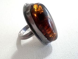 Vintage statement ring featuring a large, oval cognac Baltic amber cabochon. $150 or best offer.