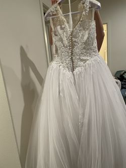 Brand new Pronovious Bridal Size 14 Wedding Dress. Never Worn