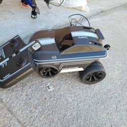 Sharper Image RC Stunt Mongoose Glow Racer remote control car.