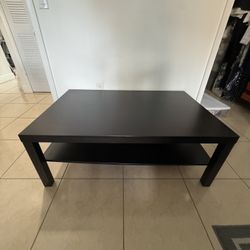 Dark brown coffee table with shelf