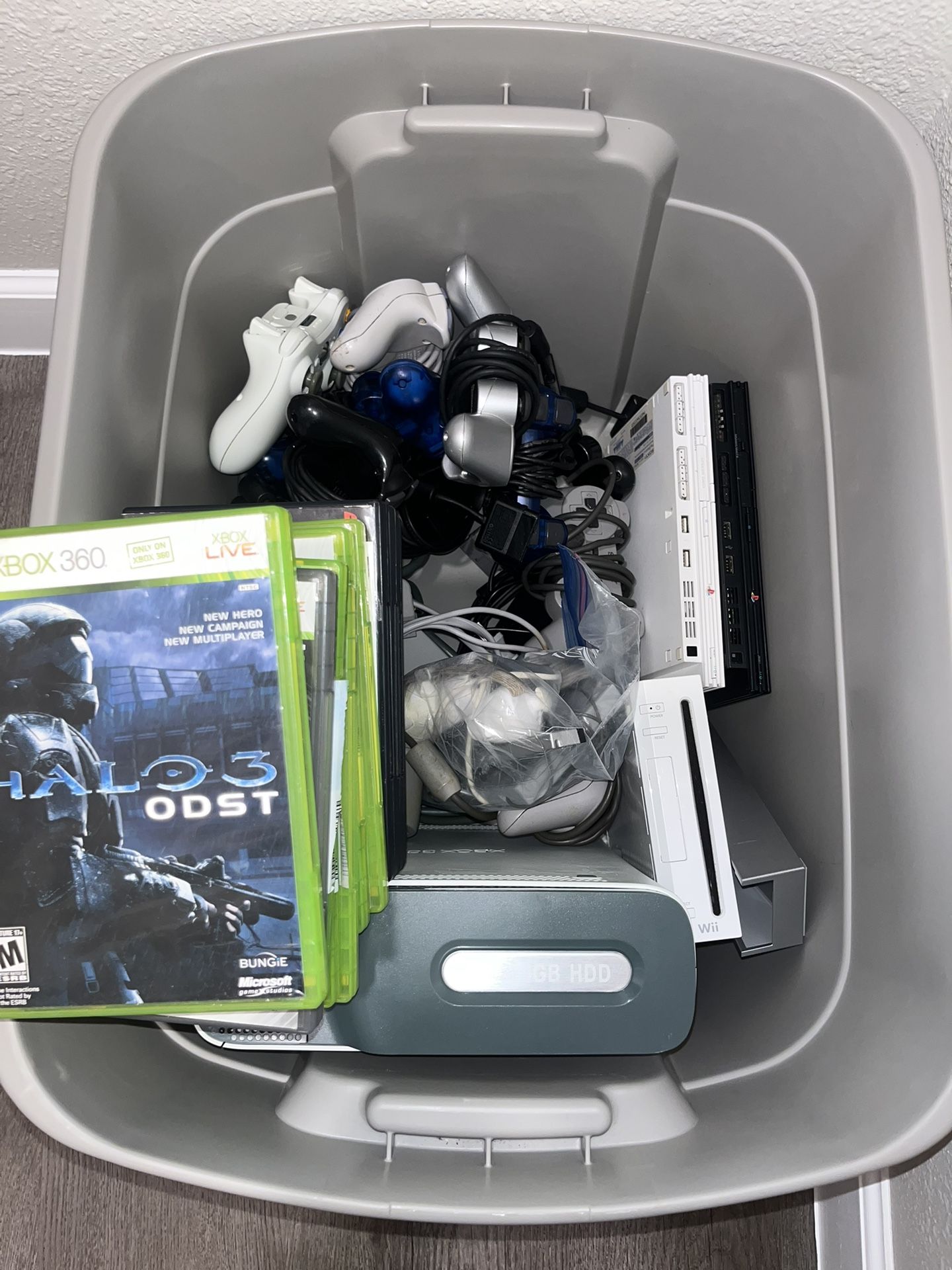 Bin Of 5 Video Game Consoles With Controllers, 19 Games, And Accessories