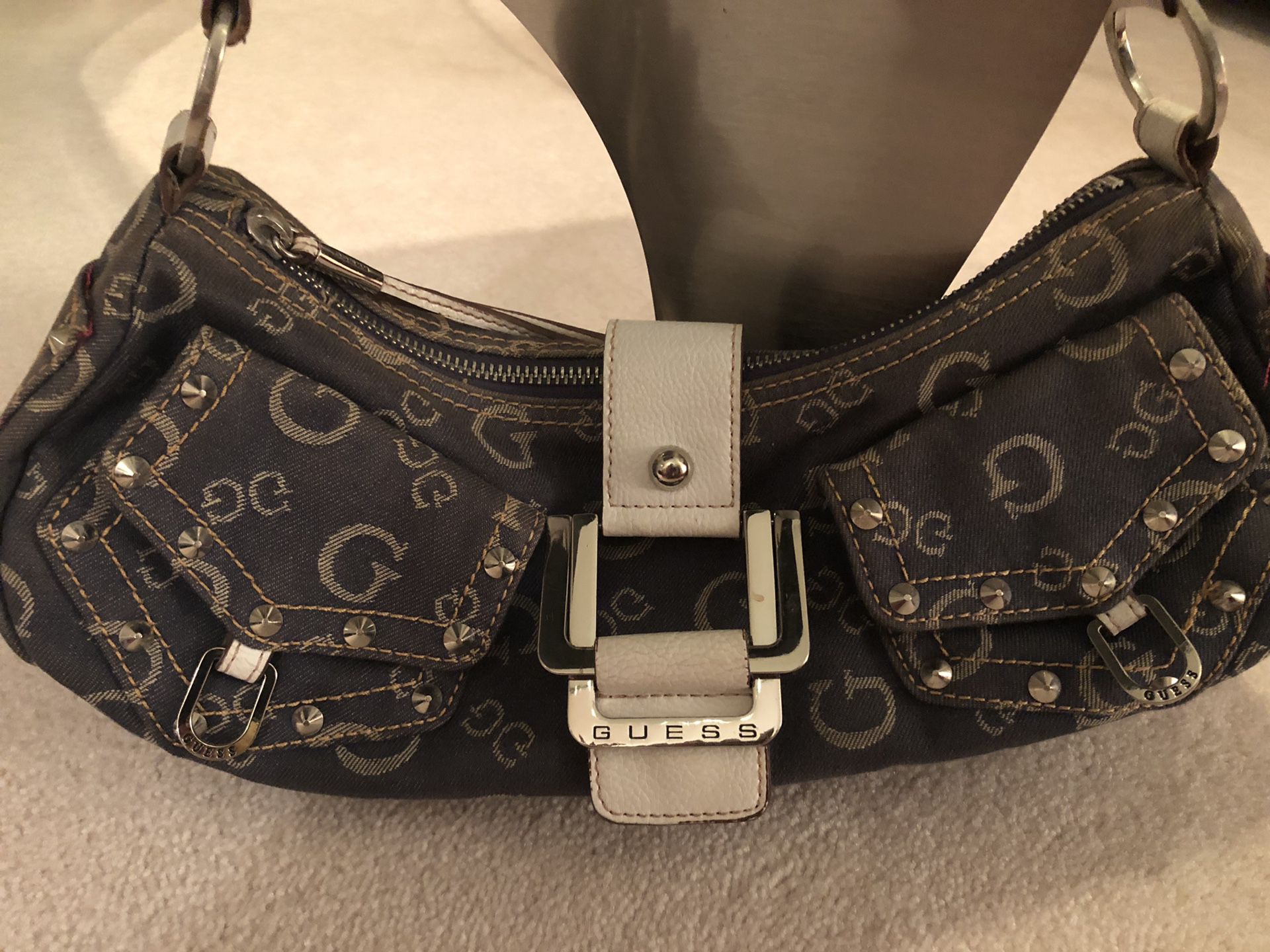 Guess denim designer purse with metal and leather details, silky interior, multiple pockets