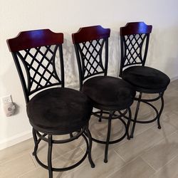 Three kitchen counter chairs