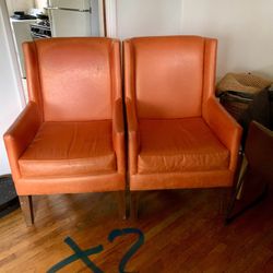 Two Faux Tangerine High back Chairs