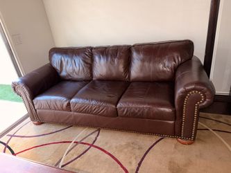 Leather couch with coffee table