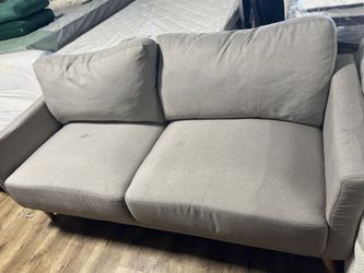 Comfortable gray sofa in good condition.