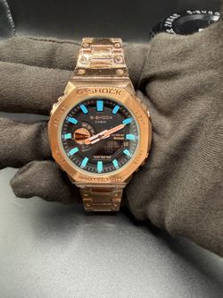 G shock rose gold blue accents