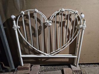Vintage victorian styled white enameled iron heart-shaped twin headboard.