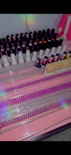 Nail polish racks with nail polishes