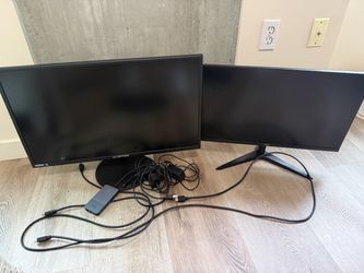 2 computer monitors, 2 docks,  keyboard, travel monitor