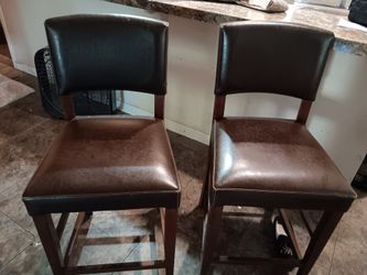 2 nice looking leather bar stools  brown