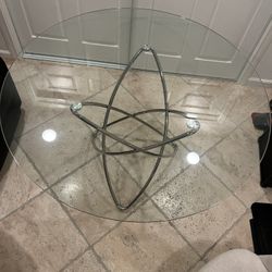 Modern Round Glass Dining Table – Sculptural Steel Base