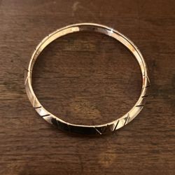 METALLIC ROSE COLOR BRACELET HAS A MAKERS MARK 