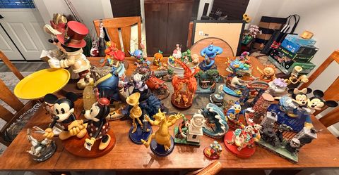 Disney Big Figs and several smaller retired pieces.