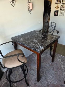 Dining room table and two barstools