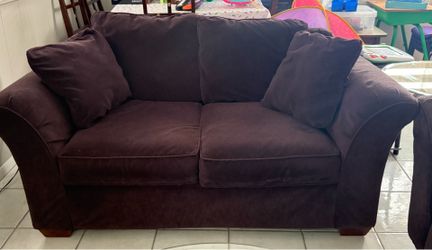 Plush putple sofa and love seat