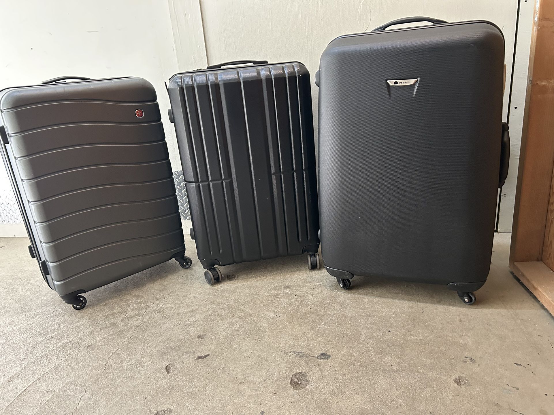 (3) XL suitcases.  PRICES VARY 