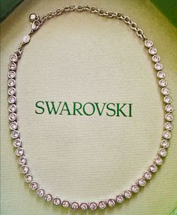 Swarovski necklace never used the bottom of the box is a little damaged but the necklace is in perfect condition