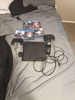 Ps4  slim..2 controllers... Games and charging station