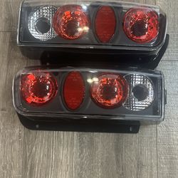 Black Housing Halogen Tail Light Set - Includes Left and Right Tail Lights (For Vehicle Fittings see Desc)