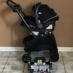 PRACTICALLY NEW CHICCO CADDY STROLLER AND CAR SEAT WITH BASE 