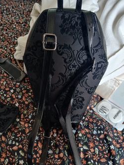 Coffin, backpacks, and wallet