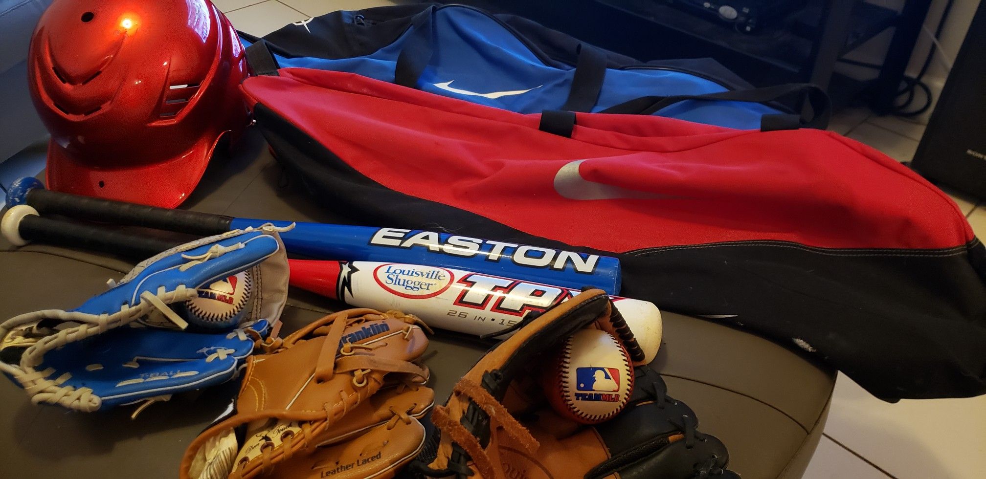 Kids baseball gear, 3 gloves, 2 bags, 1 helmet 2 bats, 2 balls