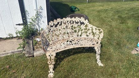 Vintage cast iron grapevine bench.