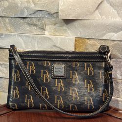 Dooney & Bourke 1975 Signature large slim wristlet in black coated canvas with tan leather trim