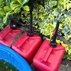 Three 2-gallon gas cans
