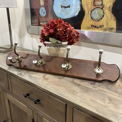 Wooden coat rack with four, strong, solid brass hooks and ceramic accents