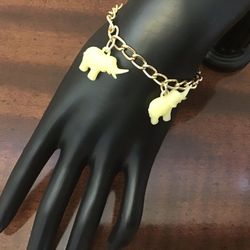 Gold Tone Bracelet with Elephants for Girl. Length: 6".  EUC