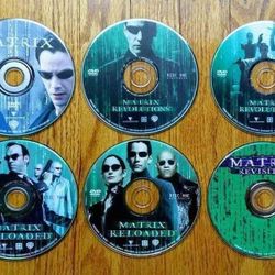 The Matrix, Matrix Reloaded, Matrix Revolutions, Matrix Revisited DVDs