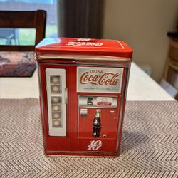 Vintage Coca-Cola vending machine tin